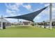 Great community area with outdoor seating, event space, and a large shade canopy at 16624 Maude Dr, Wimauma, FL 33598