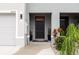 The cozy front entrance to this townhome features a covered porch at 16624 Maude Dr, Wimauma, FL 33598