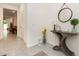 Neutral colored hallway featuring ceramic floors and decorative accents at 16624 Maude Dr, Wimauma, FL 33598