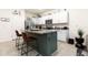 Kitchen with a central island, granite countertops, stainless appliances, and bar stool seating at 16624 Maude Dr, Wimauma, FL 33598
