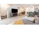 Open floor plan living room and kitchen with stainless steel appliances and stylish island seating at 16624 Maude Dr, Wimauma, FL 33598
