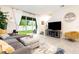 Spacious living room featuring backyard access, lots of natural light, and stairs to the second floor at 16624 Maude Dr, Wimauma, FL 33598
