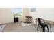Versatile office space with a stylish rug, plenty of natural light, and space for dual desks at 16624 Maude Dr, Wimauma, FL 33598