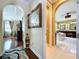 Elegant hallway view into primary bathroom with dual vanities and jacuzzi, blending luxury and convenience at 1947 Marshberry Ct, Trinity, FL 34655