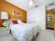 Cozy bedroom featuring warm wall color, white bedding, and stylish decor for a comfortable retreat at 1947 Marshberry Ct, Trinity, FL 34655