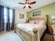 Spacious bedroom featuring a ceiling fan and bright natural light at 1947 Marshberry Ct, Trinity, FL 34655