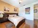This bedroom features wood floors, accent wall, ceiling fan, and recessed lighting at 1947 Marshberry Ct, Trinity, FL 34655