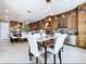 Dining room with kitchen features built-in cabinetry, stainless steel appliances, and tile flooring at 1947 Marshberry Ct, Trinity, FL 34655