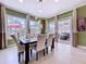 Bright dining room with views of outdoor patio offers an elegant space for meals and celebrations at 1947 Marshberry Ct, Trinity, FL 34655