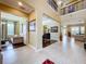 Expansive foyer with tile flooring showcases the open floor plan and access to multiple living spaces at 1947 Marshberry Ct, Trinity, FL 34655