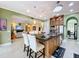 Gourmet kitchen with island, granite countertops, custom cabinets, and open to the living room at 1947 Marshberry Ct, Trinity, FL 34655
