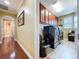 Well-organized laundry room featuring cabinets, modern black washer and dryer, tile flooring, and a hair-wash chair at 1947 Marshberry Ct, Trinity, FL 34655