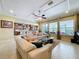 Spacious living room features large windows and is open to the kitchen, perfect for entertaining guests at 1947 Marshberry Ct, Trinity, FL 34655