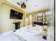 Luxurious primary bathroom with jacuzzi, television, and modern fixtures, perfect for unwinding and relaxation at 1947 Marshberry Ct, Trinity, FL 34655