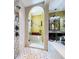 Beautiful primary bathroom featuring glass shower, seating area, and modern fixtures, combining luxury and relaxation at 1947 Marshberry Ct, Trinity, FL 34655