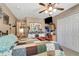 Comfortable bedroom features a ceiling fan, and a unique quilt, closet and a decorated bureau at 213 Draw Bridge Ln, Valrico, FL 33594