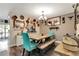 Charming dining room features a rustic table with bench seating and decorative wall accents at 213 Draw Bridge Ln, Valrico, FL 33594