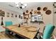 Warm dining area featuring a wooden table with a chandelier and eclectic decor at 213 Draw Bridge Ln, Valrico, FL 33594