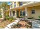Charming townhouse with a covered porch, stone accents, and well-manicured landscaping at 213 Draw Bridge Ln, Valrico, FL 33594
