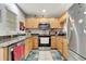 Cozy kitchen featuring stainless steel appliances, granite countertops and light wood cabinetry at 213 Draw Bridge Ln, Valrico, FL 33594