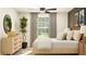 Stylish bedroom featuring a bed, nightstands, a plant, carpeted floors, and natural light at 22363 Nebula Way, Land O Lakes, FL 34637