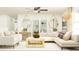 Cozy living space with plush seating, modern decor, stylish lighting, and bright neutral color scheme at 22363 Nebula Way, Land O Lakes, FL 34637