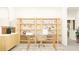 Well-lit home office with a glass-top desk, shelving for storage, and a modern design for a productive workspace at 22363 Nebula Way, Land O Lakes, FL 34637