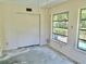 Bedroom featuring a large closet and two windows offering natural light and a view of the outdoors at 2391 Sumatran Way # 37, Clearwater, FL 33763