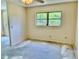 Bright bedroom with large windows, ceiling fan, and visible flooring work in progress at 2391 Sumatran Way # 37, Clearwater, FL 33763