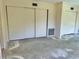 Bedroom featuring closet space and showing visible flooring project getting underway at 2391 Sumatran Way # 37, Clearwater, FL 33763