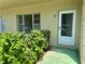 Home entrance with the number 37 above the white door and a window to the left at 2391 Sumatran Way # 37, Clearwater, FL 33763