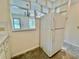 Kitchen featuring a refrigerator with a pass through window at 2391 Sumatran Way # 37, Clearwater, FL 33763