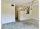 Bright living space with ceiling fan, decorative wall, and an opening to another room at 2391 Sumatran Way # 37, Clearwater, FL 33763