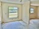 Bright living room with large windows, back yard views, ceiling fan and flooring project visible at 2391 Sumatran Way # 37, Clearwater, FL 33763