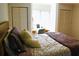 Bedroom with two large closets, hardwood floors, natural light and inviting bed at 2737 Enterprise E Rd # 192, Clearwater, FL 33759