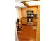 Well-lit kitchen with stainless steel appliances, wood cabinets, and natural light from the window at 2737 Enterprise E Rd # 192, Clearwater, FL 33759