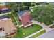 Bird's eye view of the home, showcasing its layout, surrounding landscape, and backyard pool area at 2824 Paddock Dr, Palm Harbor, FL 34684
