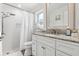 Bathroom with updated vanity and shower/tub combo at 2824 Paddock Dr, Palm Harbor, FL 34684
