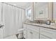 Bathroom with updated vanity and shower/tub combo at 2824 Paddock Dr, Palm Harbor, FL 34684
