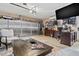 This garage is decorated like a home office and features a dark wooden desk and metallic storage cabinets at 2824 Paddock Dr, Palm Harbor, FL 34684