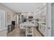 Bright kitchen featuring white cabinets, stainless steel appliances, and a center island at 2824 Paddock Dr, Palm Harbor, FL 34684