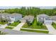 Aerial view of a home with a well-kept lawn and landscaping in a suburban neighborhood at 2898 Living Coral Dr, Odessa, FL 33556