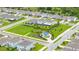 An aerial view shows the neighborhood with a blue picnic shelter in the community park at 2898 Living Coral Dr, Odessa, FL 33556