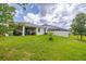 Spacious backyard with lush green grass, offering ample space for recreation and relaxation at 2898 Living Coral Dr, Odessa, FL 33556