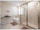 Modern bathroom featuring a glass shower, separate tub, and ceramic tile surround at 2898 Living Coral Dr, Odessa, FL 33556