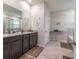 Bathroom featuring a granite countertop, gray cabinets, and ceramic tile floors at 2898 Living Coral Dr, Odessa, FL 33556