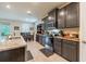 Spacious kitchen featuring granite countertops, stainless steel appliances, and ample cabinet space at 2898 Living Coral Dr, Odessa, FL 33556