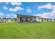 Expansive backyard showcasing a covered patio, perfect for outdoor living and entertaining at 3082 Forrest Plum Ct, Zephyrhills, FL 33540
