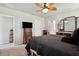 View of a Primary bedroom featuring a ceiling fan and neutral decor at 3082 Forrest Plum Ct, Zephyrhills, FL 33540
