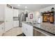 Contemporary kitchen featuring stainless steel appliances, granite countertops, and ample cabinet space at 3082 Forrest Plum Ct, Zephyrhills, FL 33540